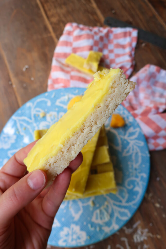 inside coconut shortbread bar with mango glaze