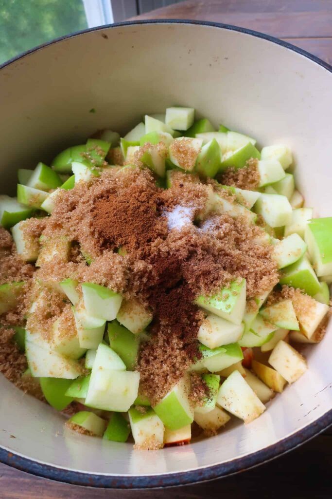 chopped apples and spices in dutch oven