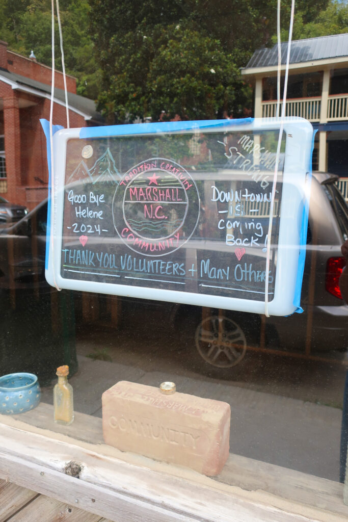 marshall nc strong sign in shop window