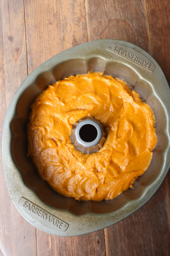 pumpkin cake batter in bundt pan