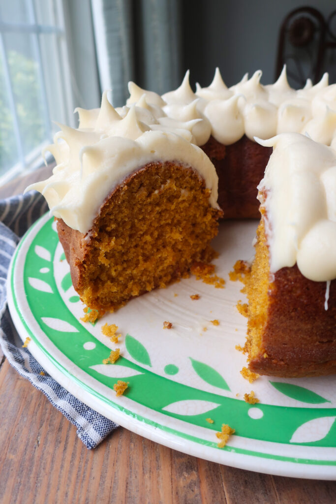 inside of soft pumpkin cake with cream cheese frosting
