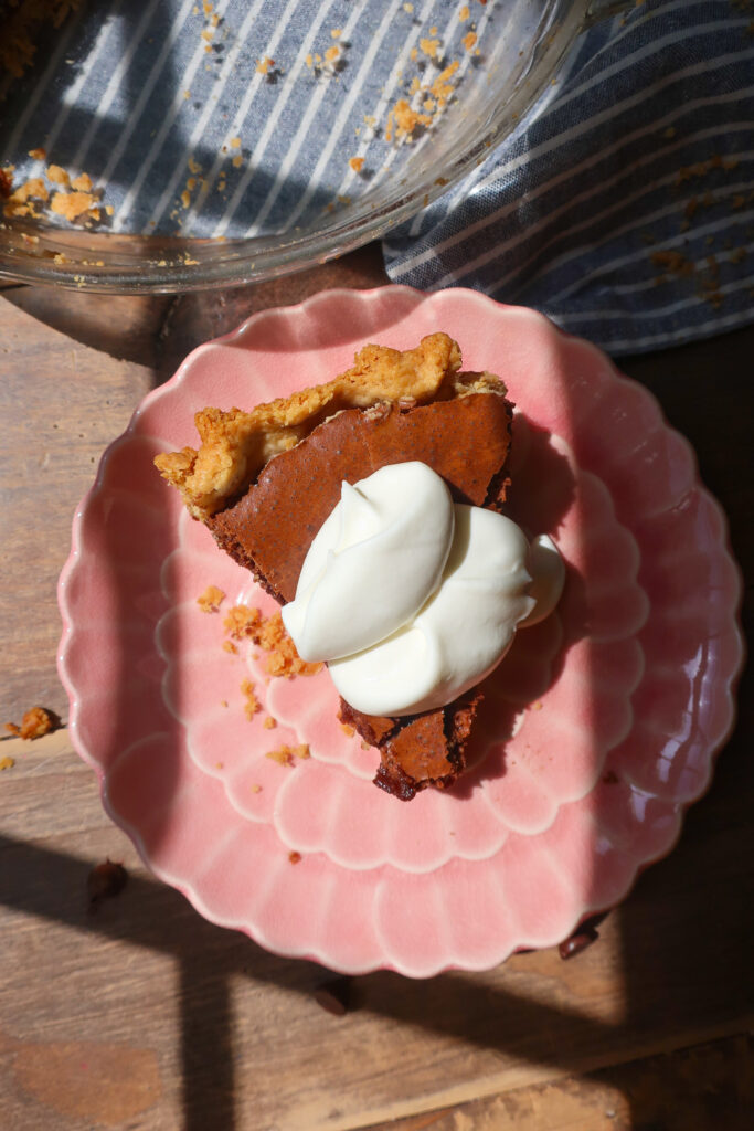 chocolate fudge pie slice with fresh whipped cream
