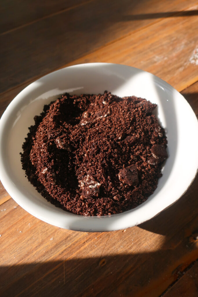 Oreo cookie crumbles in white bowl