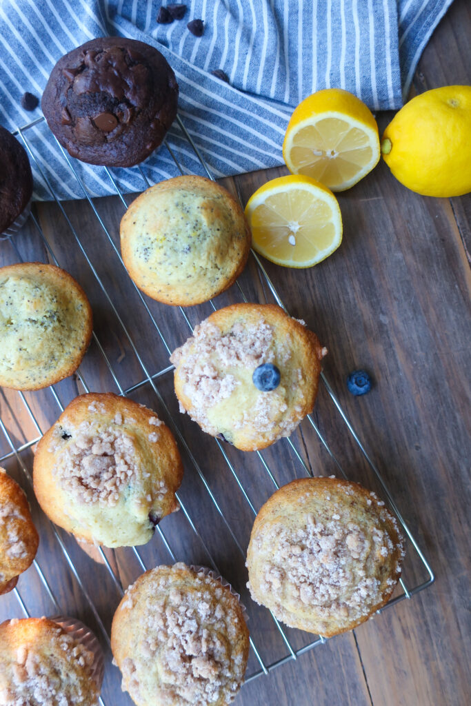 four muffin flavors cooling on wire rack