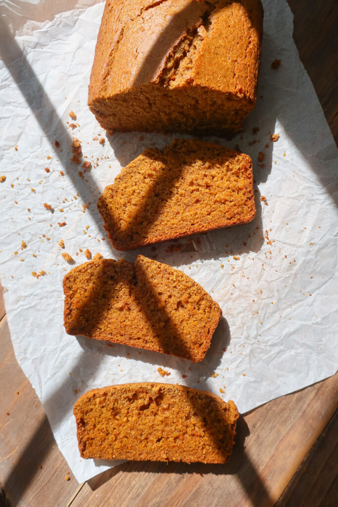 slices of sweet potato no-banana banana bread on parchment paper