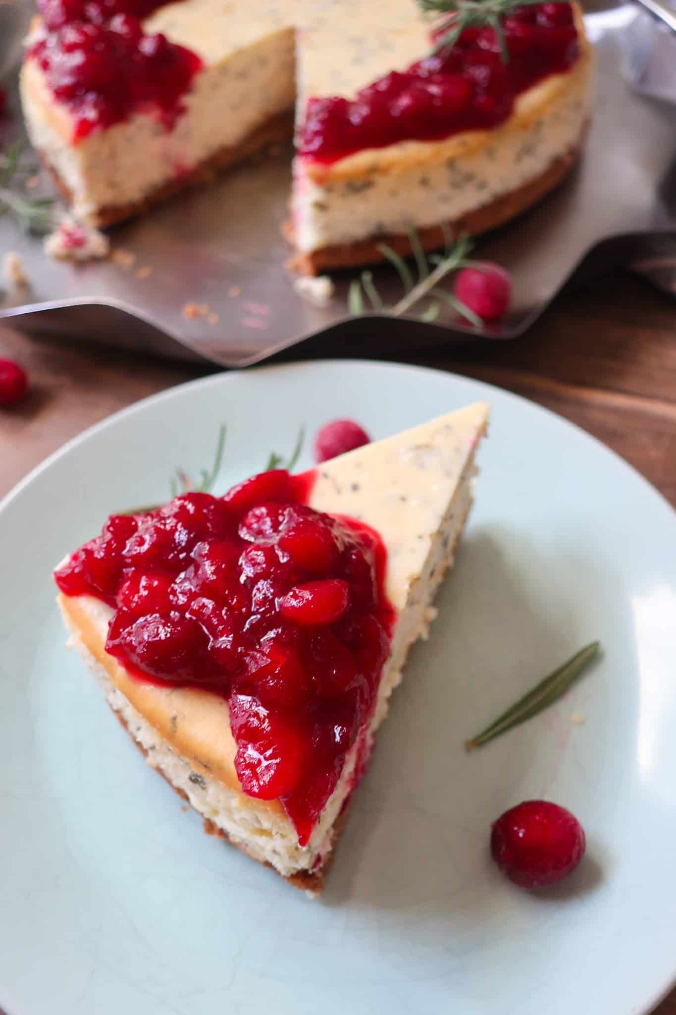 slice of cheesecake topped with cranberry compote
