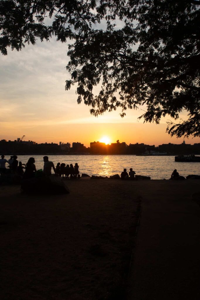 sunsets over domino park in williamsburg brooklyn one of the best neighborhoods to visit in nyc