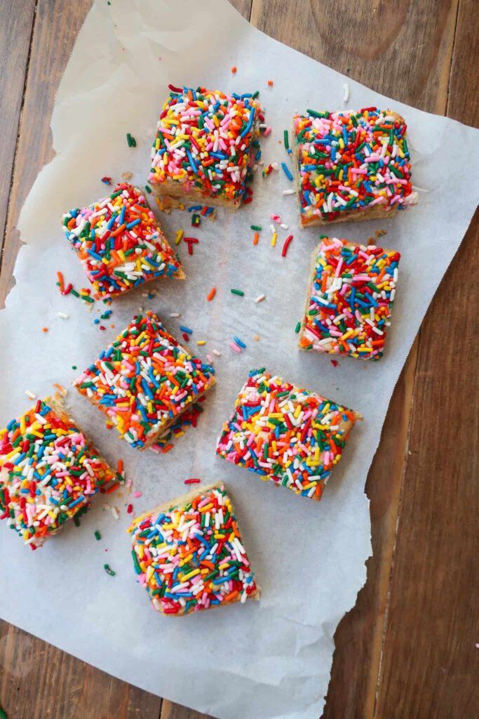small batch sprinkle sugar cookie bars on parchment