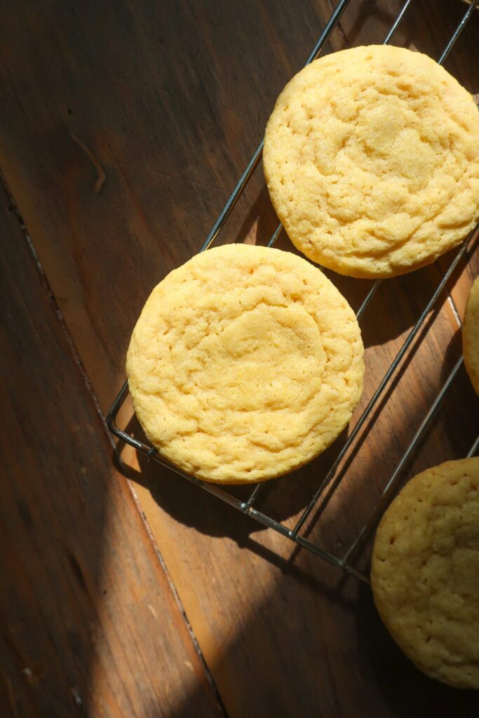 yellow cake cookies cooling on rack