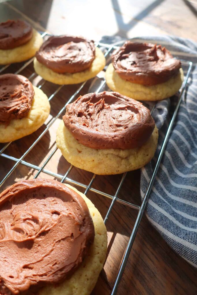 side of yellow cake cookies with frosting