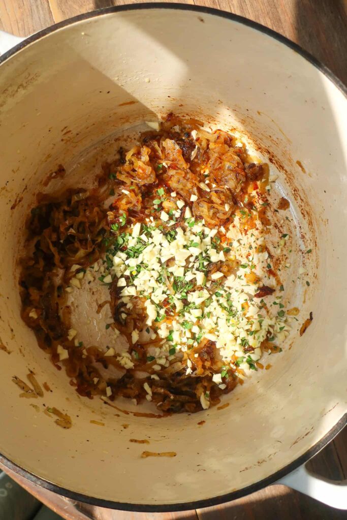 fresh garlic and thyme cooking down with caramelized onions