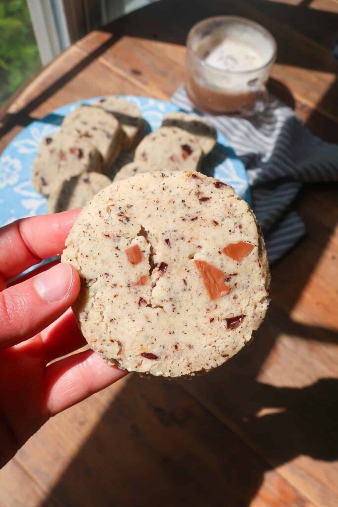 holding earl grey chocolate chunk shortbread cookie