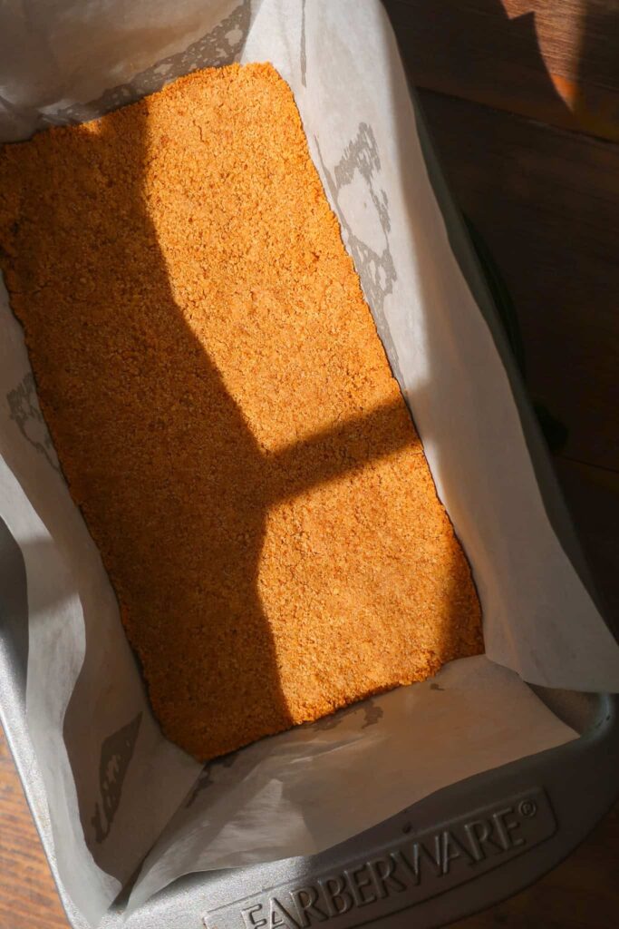 baked graham cracker crust in loaf pan