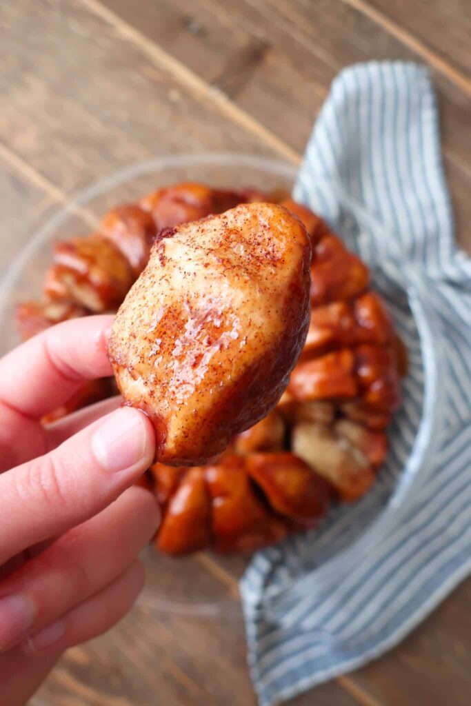 holding piece of cinnamon bubble bread
