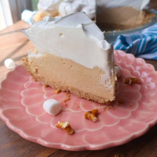 piece of peanut butter fluffernutter pie with swiss meringue on top
