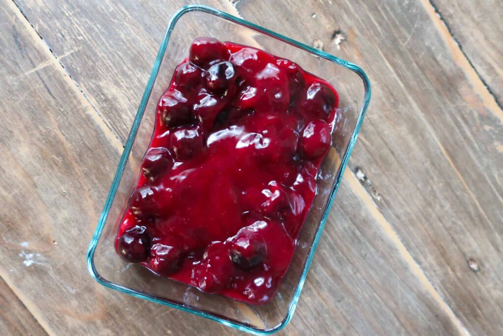 homemade cherry pie filling in glass container