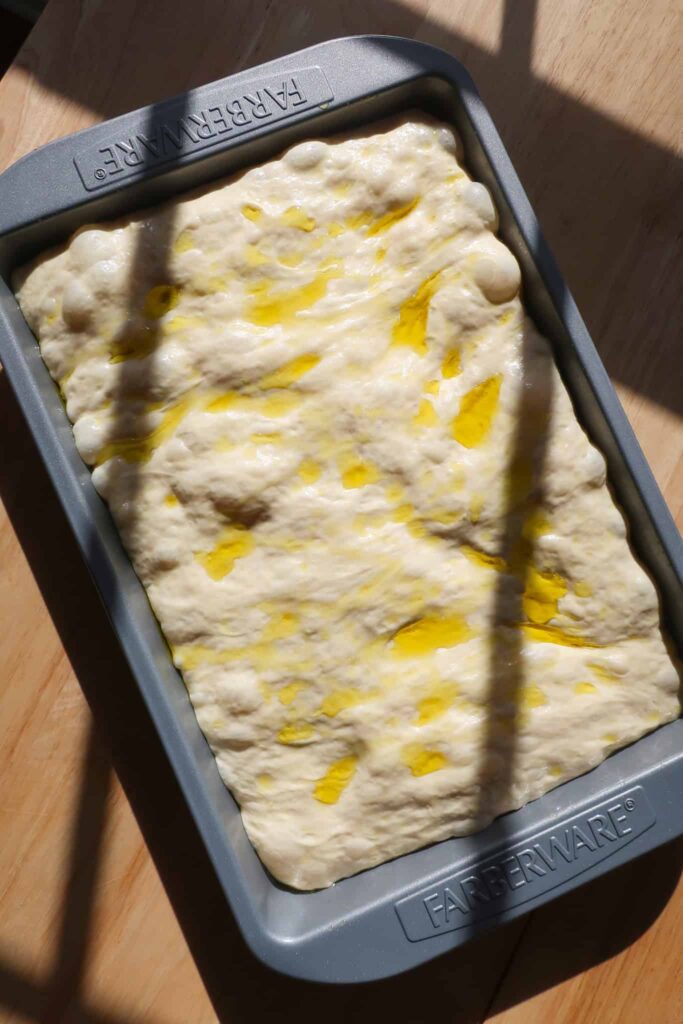focaccia dough in pan ready to bake