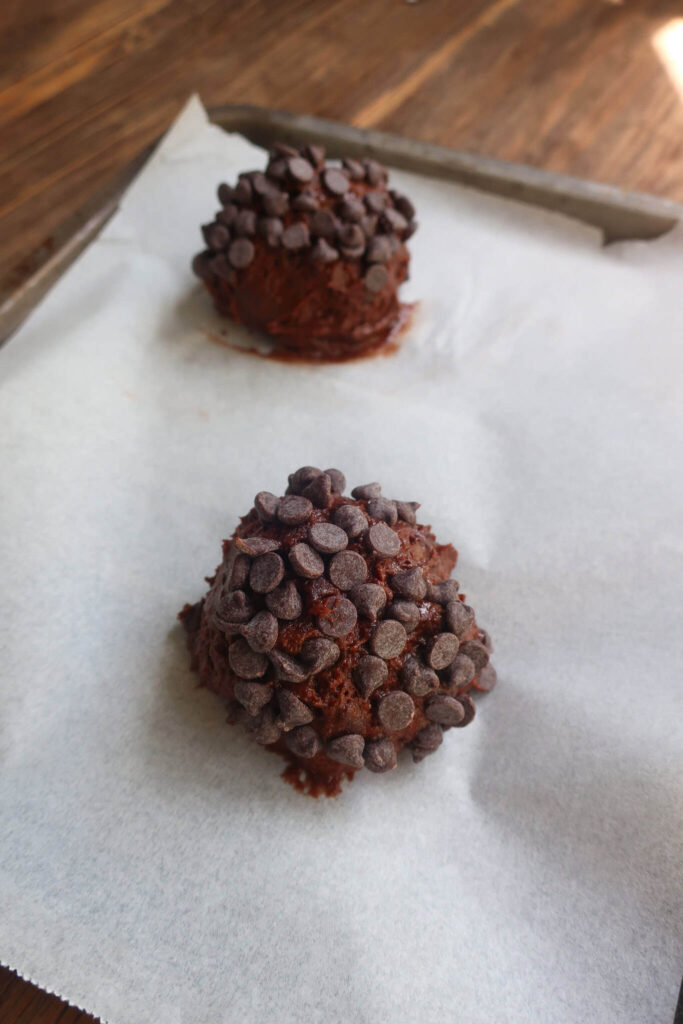scoops of double chocolate muffin tops on tray