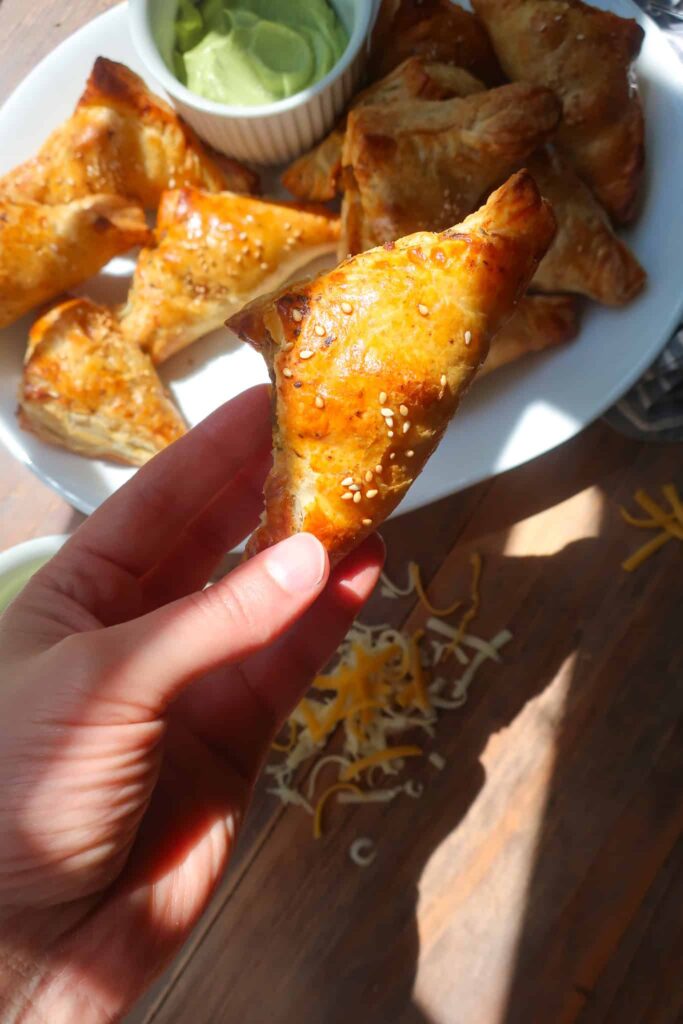 holding individual taco puff pastry